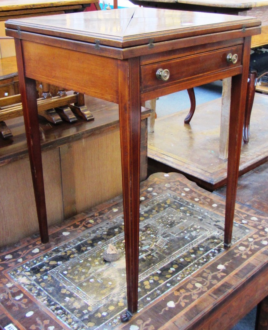 Appraisal: An Edwardian satinwood banded mahogany envelope card table with single