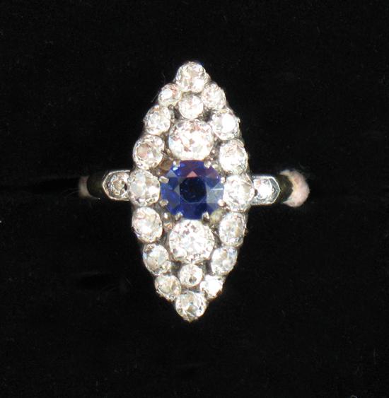 Appraisal: A SAPPHIRE AND DIAMOND DRESS RING the central round-cut sapphire