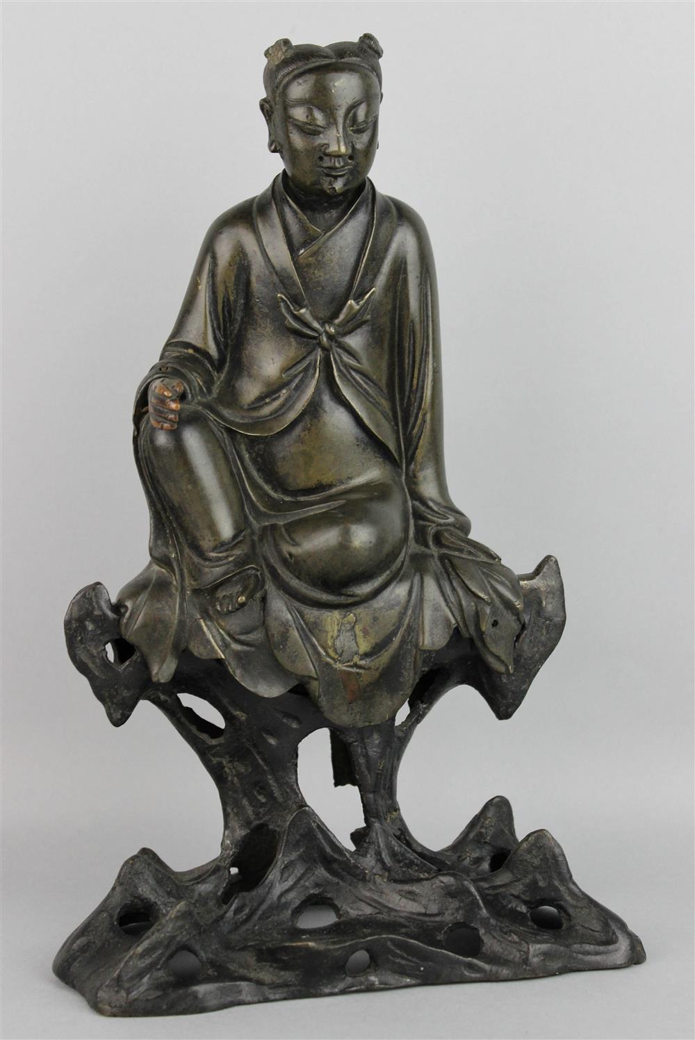 Appraisal: CHINESE BRONZE MODEL OF SEATED WOMAN ON ROCKERY MING DYNASTY