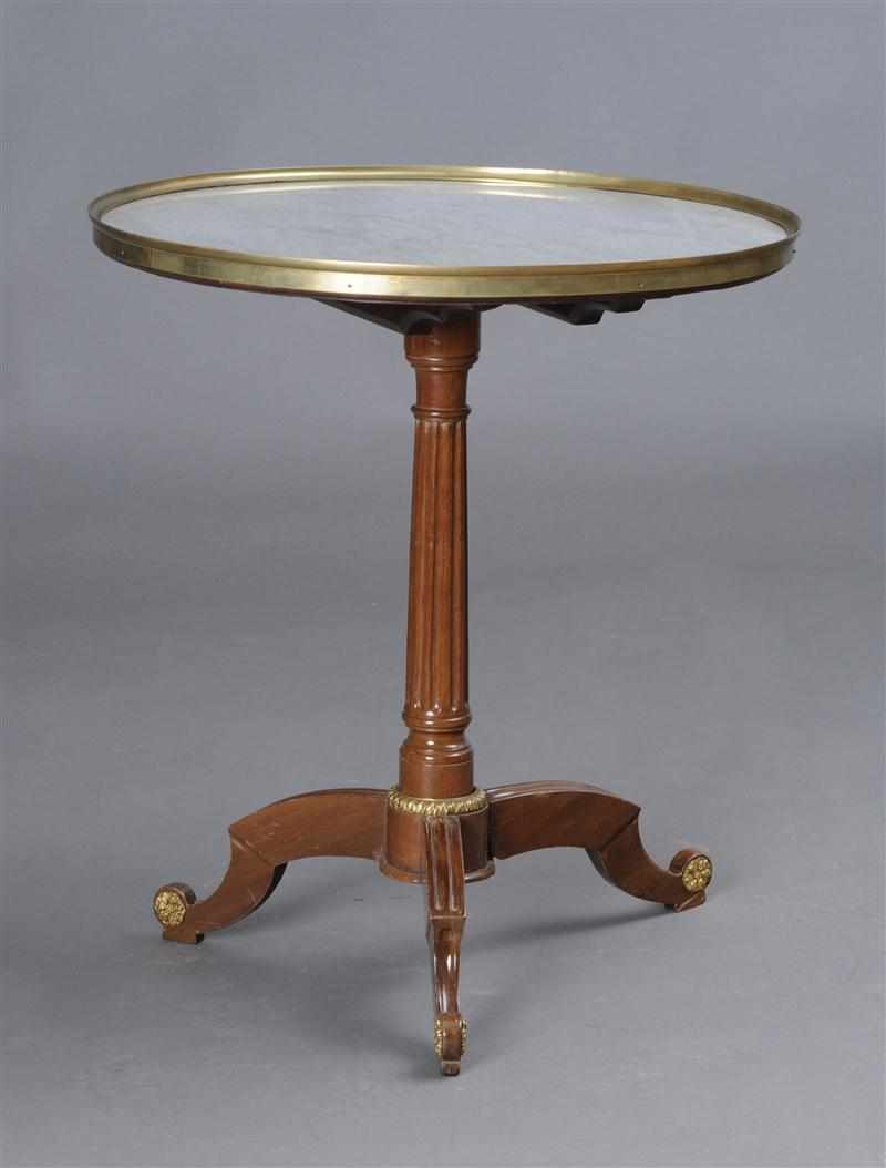 Appraisal: LOUIS XVI STYLE BRASS-MOUNTED MAHOGANY TRIPOD GU RIDON The circular