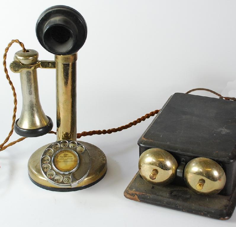 Appraisal: PLATED METAL CANDLE STICK TELEPHONE with black bakelite tulip mouthpiece