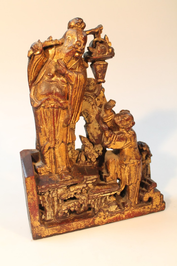 Appraisal: A thC Chinese carved hardwood figure group of a sage