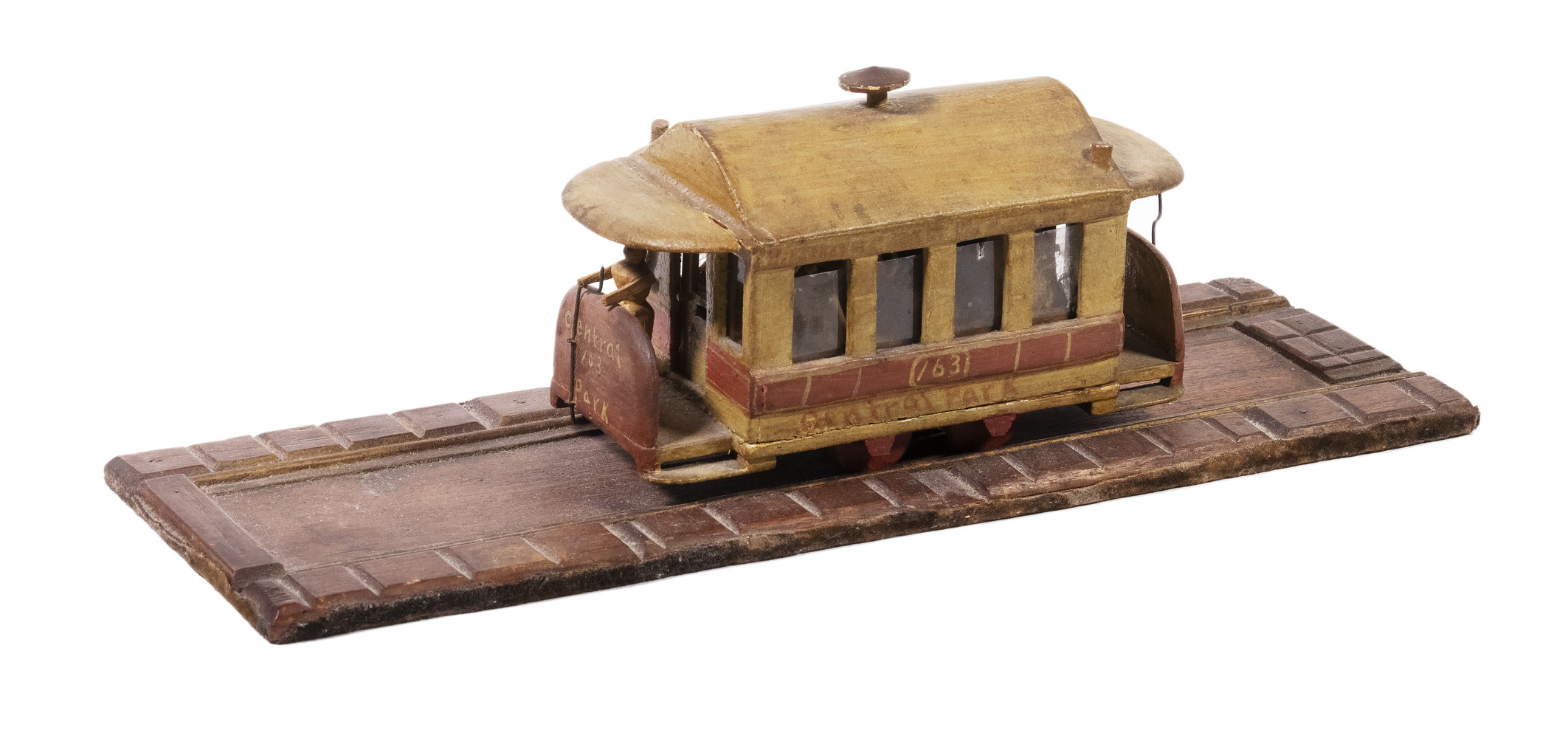 Appraisal: FOLK ART CARVED CENTRAL PARK TROLLEY ON TRACK Early th