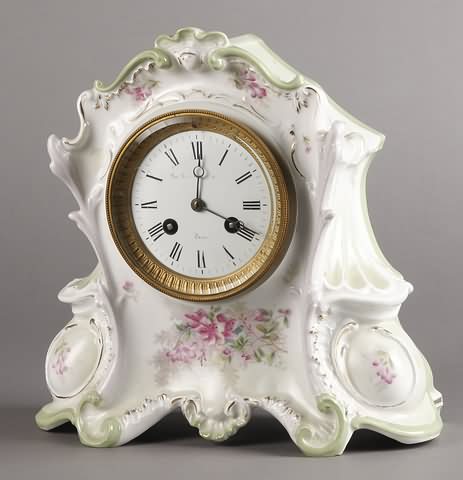 Appraisal: Circa porcelain case day time and strike movement porcelain dial