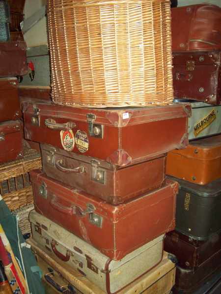 Appraisal: A COLLECTION OF SIX 'S CASES AND ONE CANE BASKET