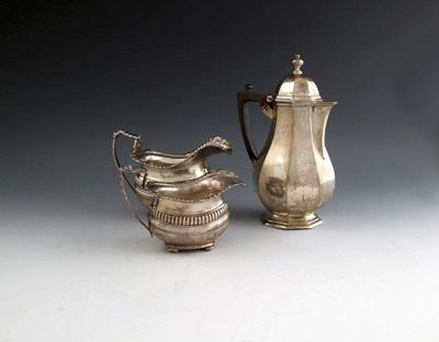 Appraisal: A pair of modern silver cream milk jugs by George