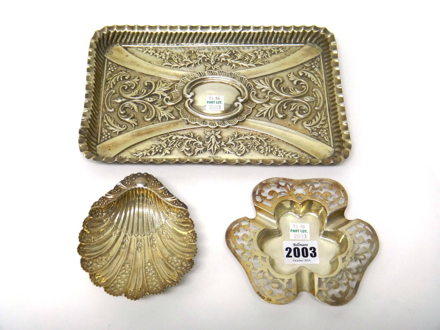 Appraisal: Silver comprising a rectangular dressing table tray with embossed decoration