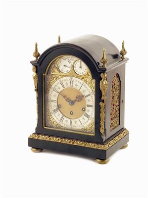 Appraisal: A Victorian ebonised and brass chiming mantle clock the three