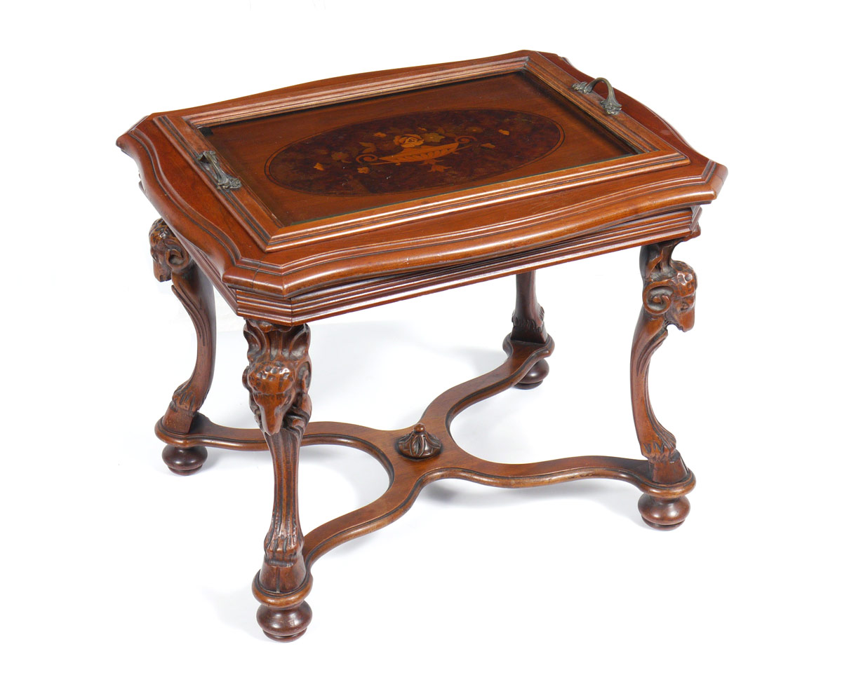 Appraisal: CARVED AND INLAID TEA TABLE Removable beveled glass top with