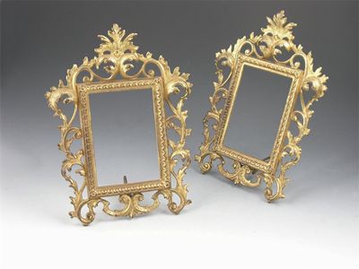 Appraisal: A pair of gilt brass photo frames of oak and