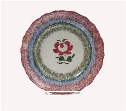 Appraisal: Spatterware plate th century Red blue and green rainbow spatter