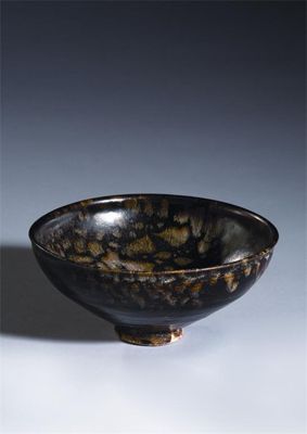 Appraisal: A Chinese jizhou tortoiseshell-glazed bowl raised on a short slightly