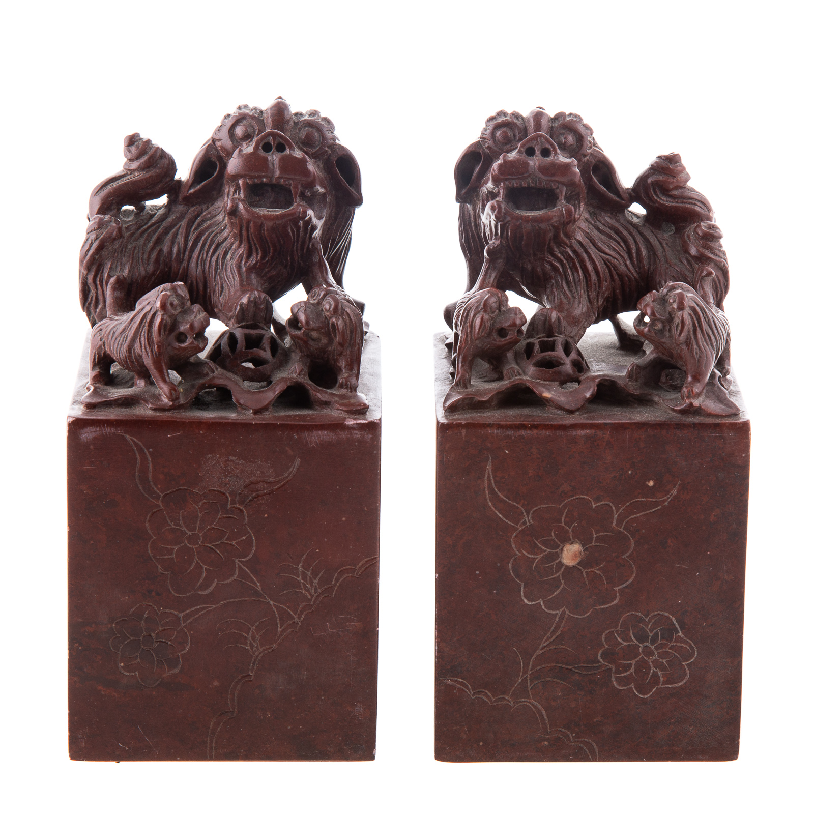 Appraisal: A PAIR OF CARVED HARDSTONE CHOPS Early th century having