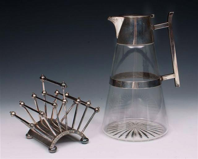 Appraisal: A SILVER PLATE RETRACTABLE TOAST RACK designed by Christopher Dresser