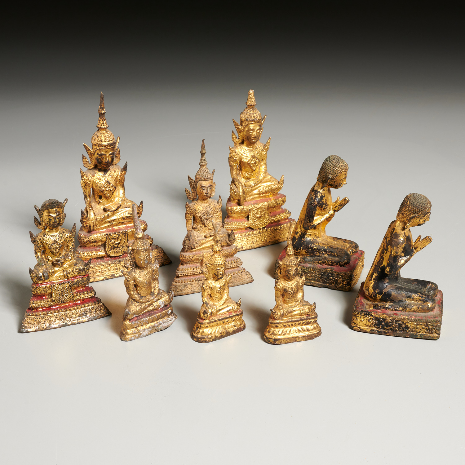 Appraisal: THAI MINIATURE GILT BRONZE BODHISATTVA th c incl devotees kneeling