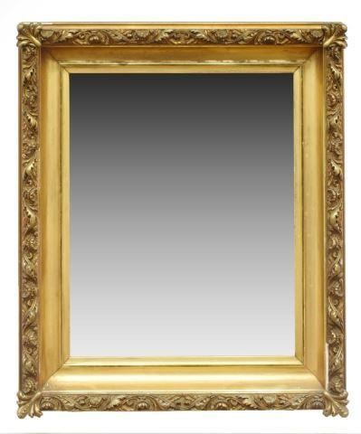 Appraisal: Parcel-gilt hanging wall mirror featuring beveled mirror plate encased in