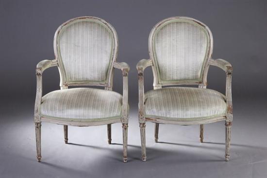 Appraisal: PAIR LOUIS XVI CREAM-PAINTED FAUTEUILS early th century Each cartouche-form