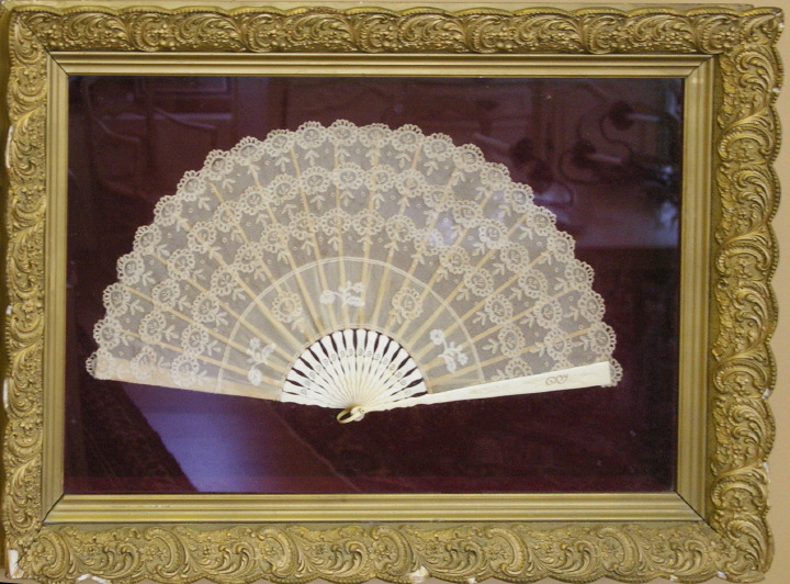 Appraisal: Large French Carved Ivory and Embroidered White Lace Fan of