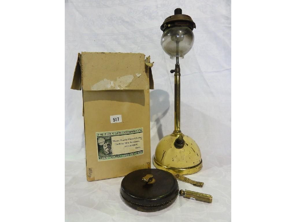 Appraisal: A Tilley lamp complete with original box a leather bound