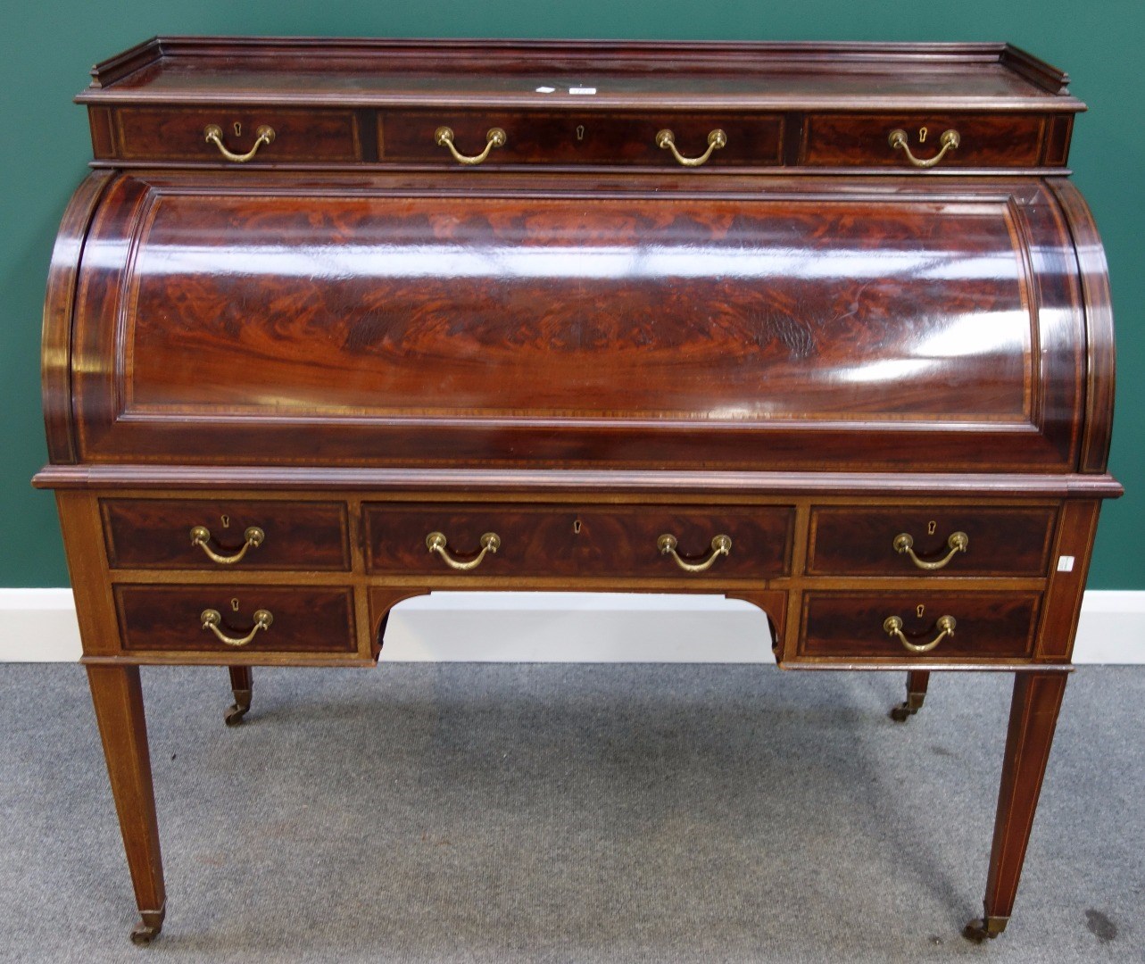 Appraisal: A late th century satinwood banded mahogany cylinder bureau with