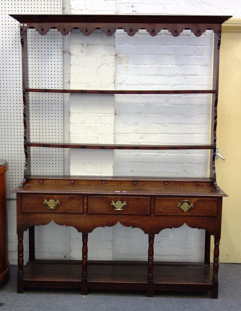 Appraisal: An th century style oak dresser the open two tier