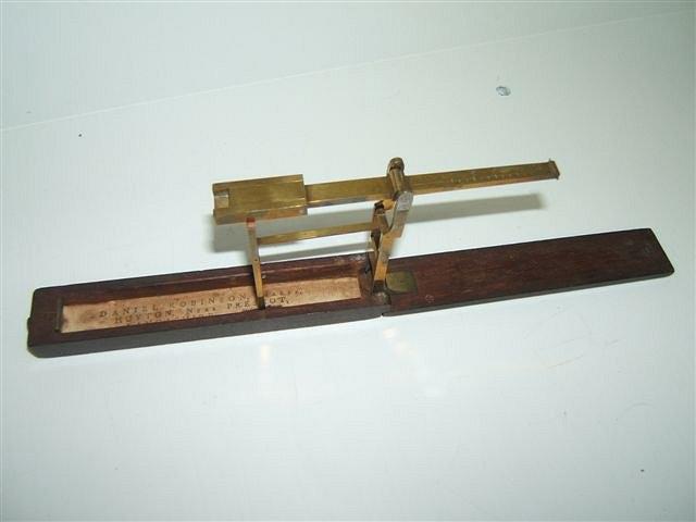 Appraisal: A GEORGIAN MAHOGANY AND BRASS GUINEA SCALES with makers label