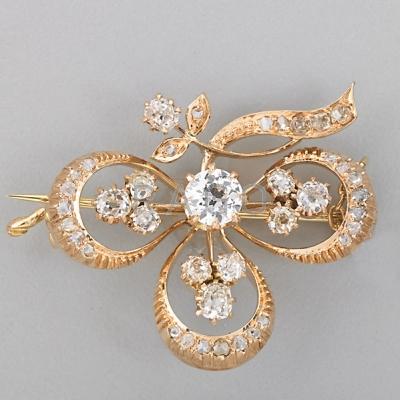 Appraisal: DIAMOND K GOLD CLOVER BROOCH Principal OEC diamond approx ct