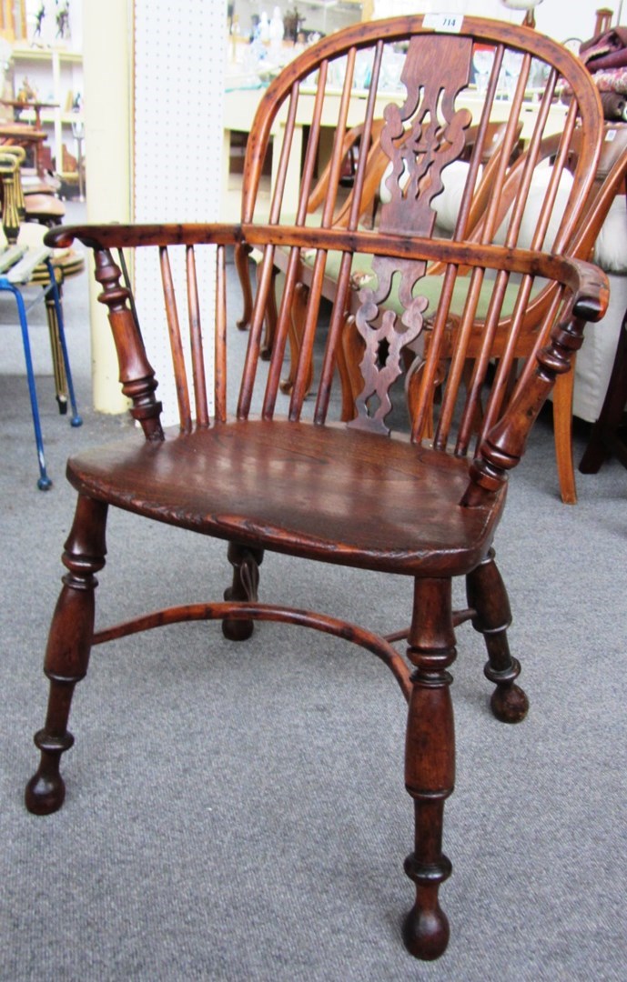 Appraisal: An th century yew and elm stickback Windsor chair on