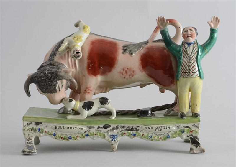 Appraisal: STAFFORDSHIRE PEARLWARE ''BULL-BAITING'' GROUP Modeled with a tethered bull with