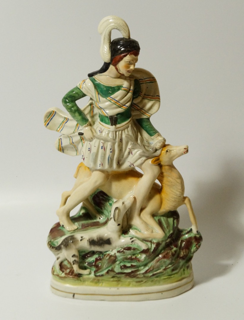 Appraisal: A mid- thC Staffordshire figure group of a gentleman in