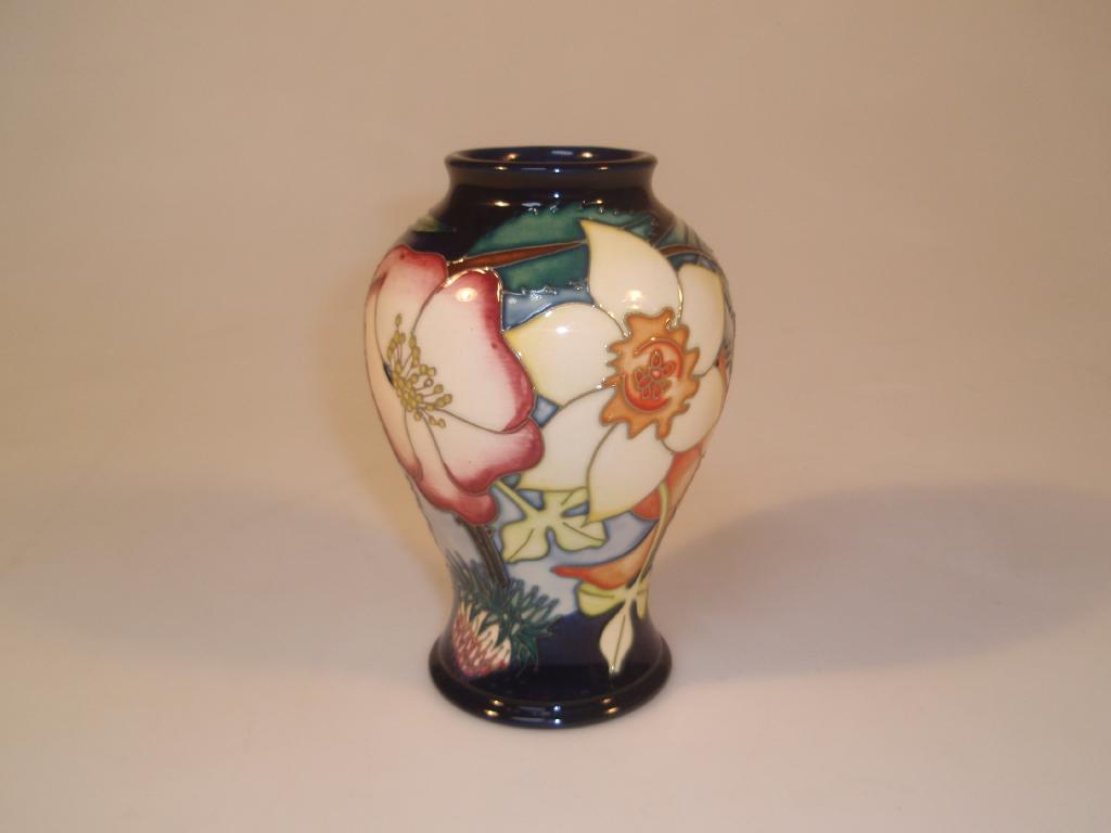 Appraisal: Moorcroft Modern an inverted baluster vase decorated with rose daffodil