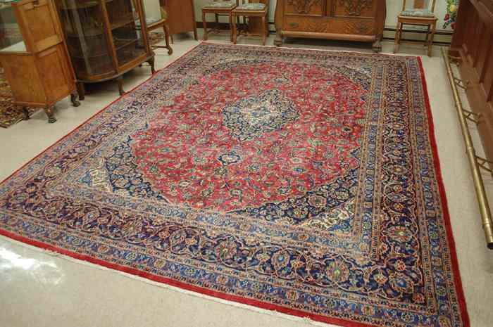 Appraisal: SEMI-ANTIQUE PERSIAN KASHAN CARPET floral and central floral medallion design