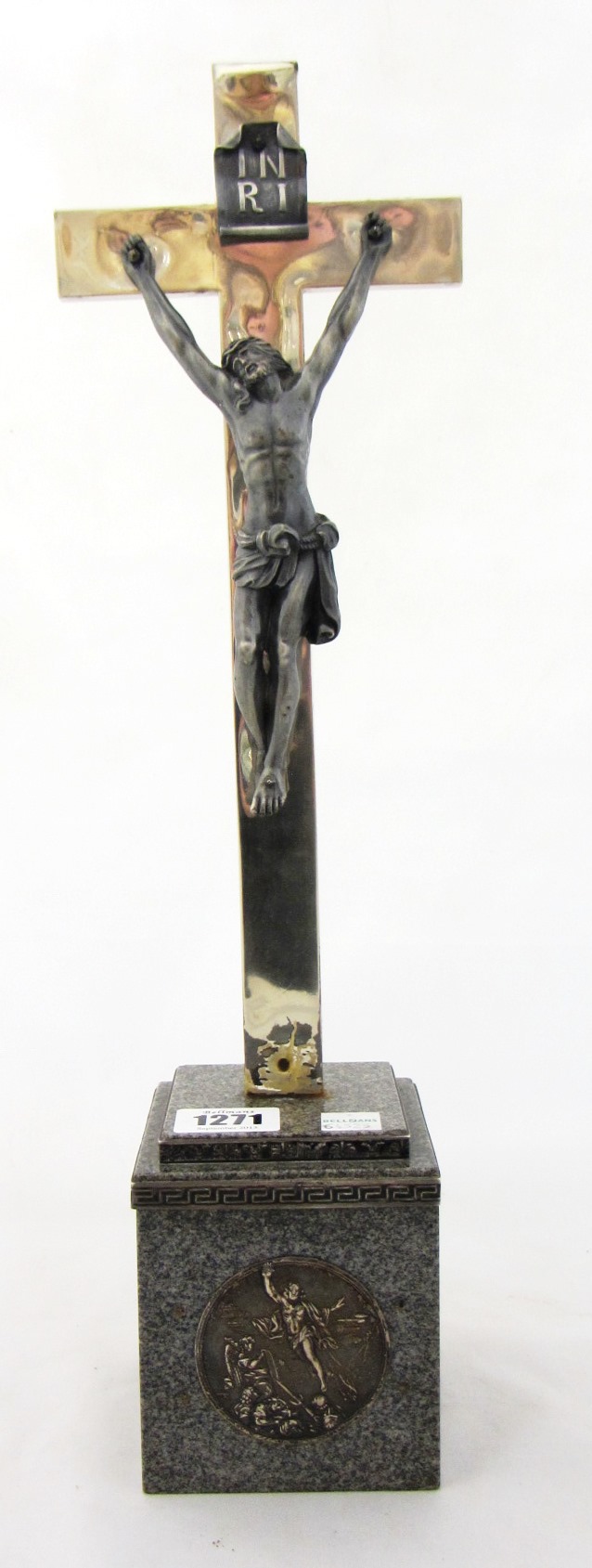 Appraisal: A Continental devotional altar crucifix on a grey stone base