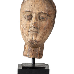 Appraisal: A Carved and Painted Wooden Head on a modern stand