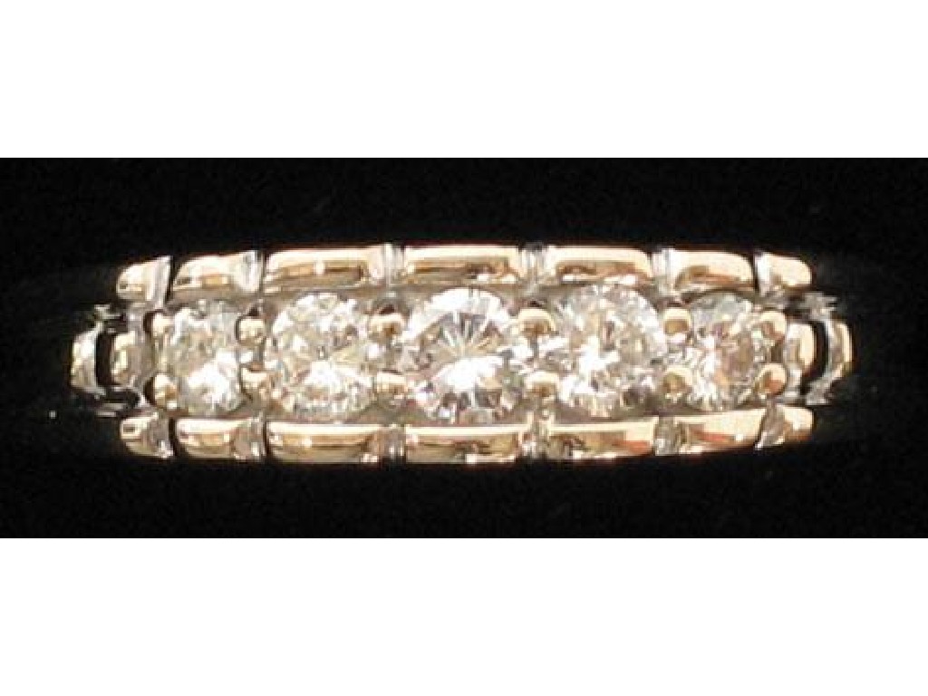 Appraisal: A FIVE STONE DIAMOND HALF-HOOP ETERNITY RING the central round