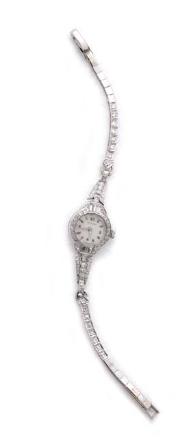 Appraisal: LADIES PLATINUM GOLD AND DIAMOND WRISTWATCH Lady's diamond cocktail wristwatch