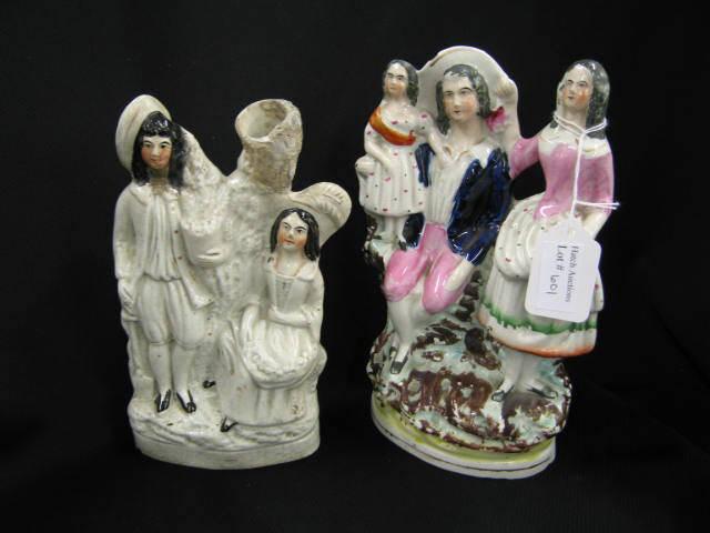 Appraisal: Early Staffordshire Figurines boy girl repaired and family minor loss