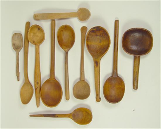 Appraisal: Eleven Hand Carved Wooden Spoons Circa Chips cracks and discoloration