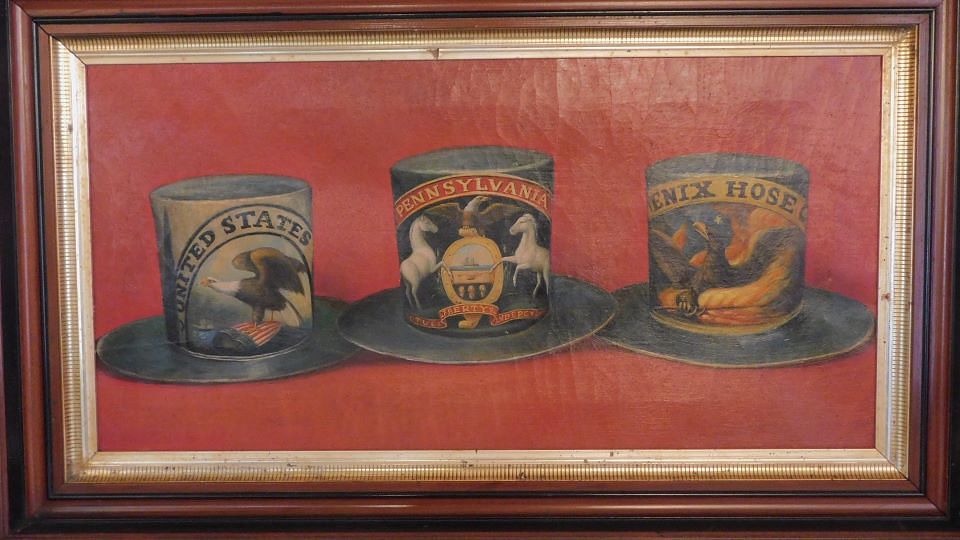 Appraisal: AMERICAN PAINTING OF FIREMAN PARADE HATS Antique oil on canvas