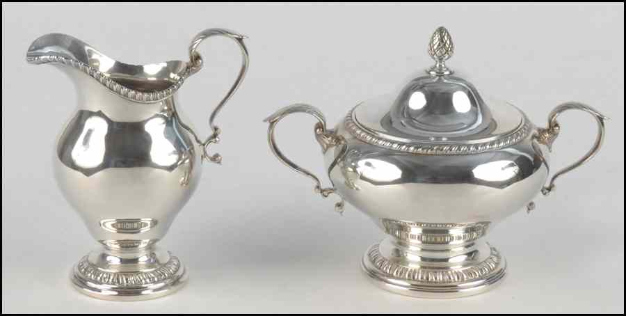 Appraisal: STERLING SILVER CREAMER AND COVERED SUGAR BOWL Bearing gadrooning detail