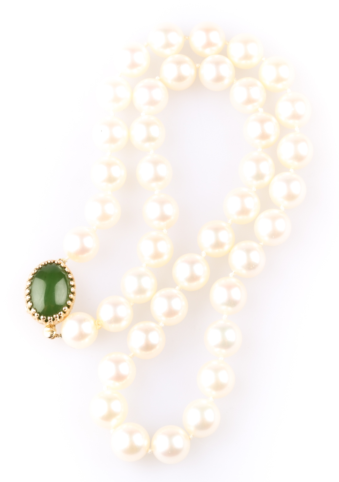 Appraisal: A Strand of Cultured Pearls with Jade Closure K yellow