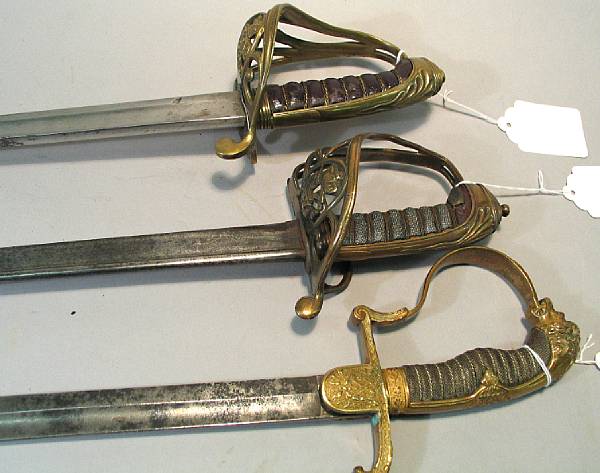 Appraisal: A lot of three military swords Comprising Imperial German lionhead