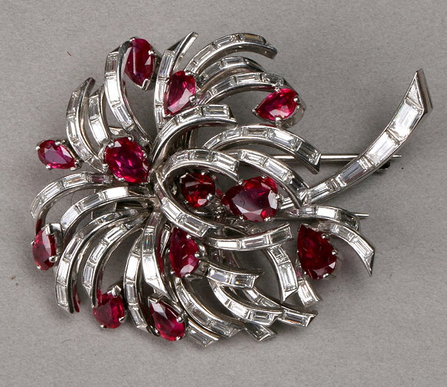 Appraisal: A RUBY AND DIAMOND SET PALM BROOCH twelve claw set