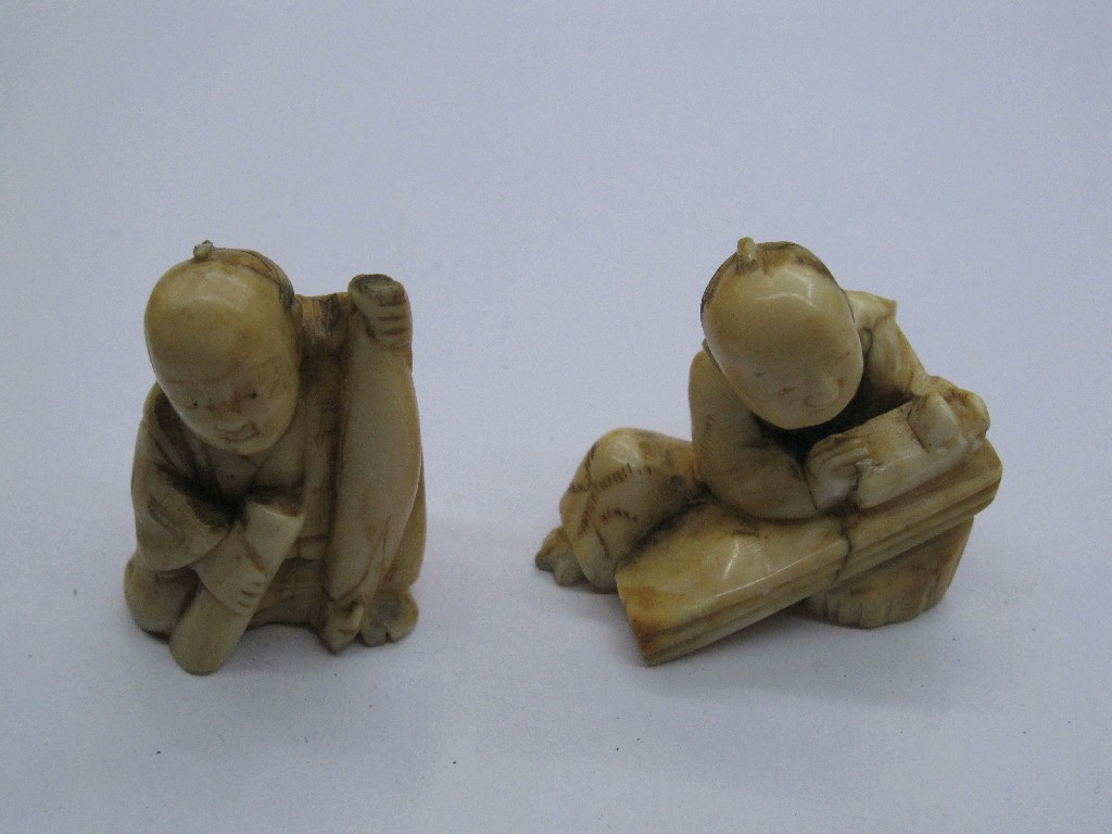 Appraisal: Lot comprising two Japanese ivory netsuke - men working