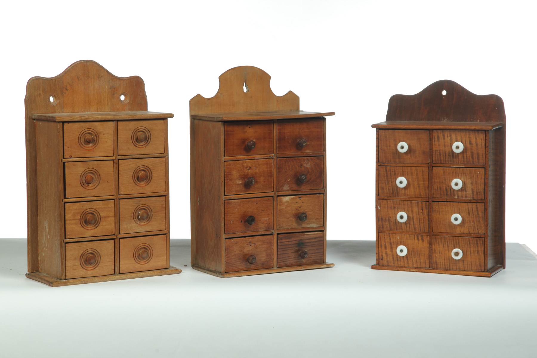 Appraisal: THREE EIGHT-DRAWER SPICE CABINETS American st quarter- th century Mixed