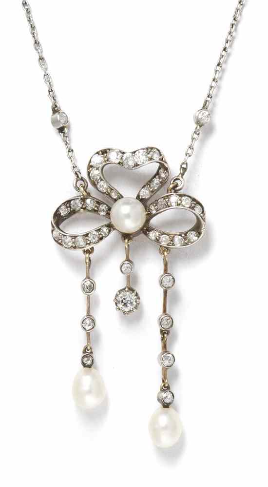 Appraisal: An Edwardian Silver Topped Gold Diamond and Pearl Bow Pendant