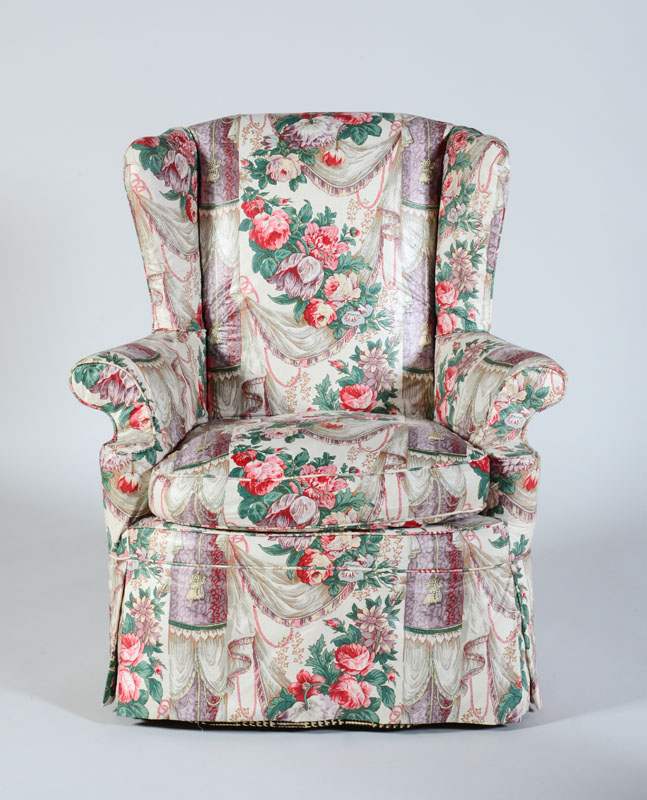 Appraisal: GEORGE III STYLE CARVED MAHOGANY WING CHAIR Upholstered in floral