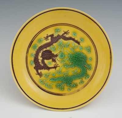 Appraisal: A Chinese Porcelain Plate Vivid yellow glazed plate with a