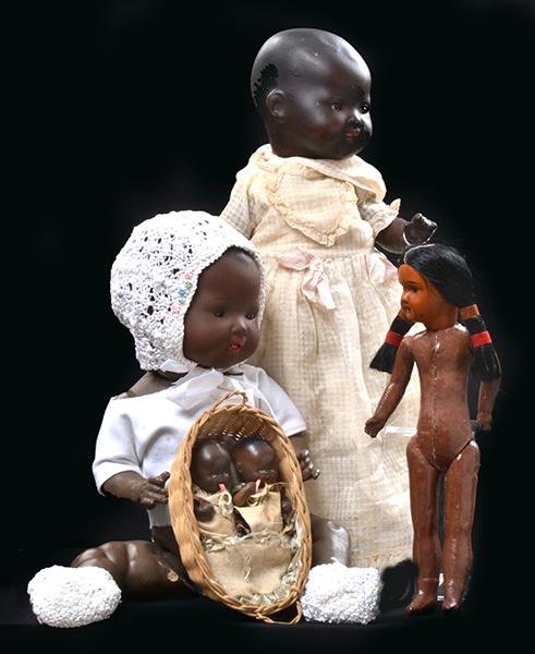 Appraisal: A GROUP OF FOUR BROWN COLOURED DOLLS including an AM