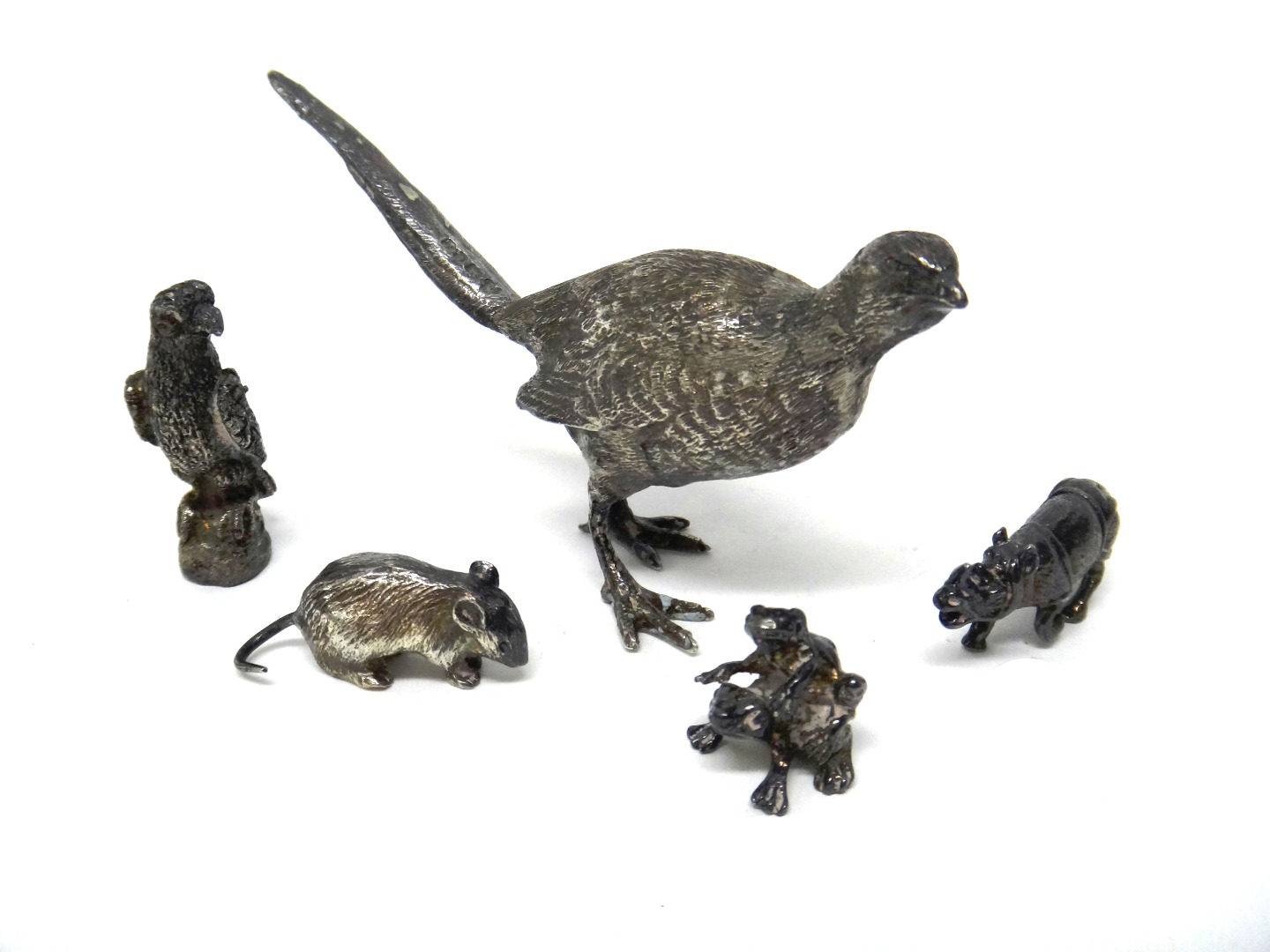 Appraisal: Fiver silver models of animals comprising a game bird London